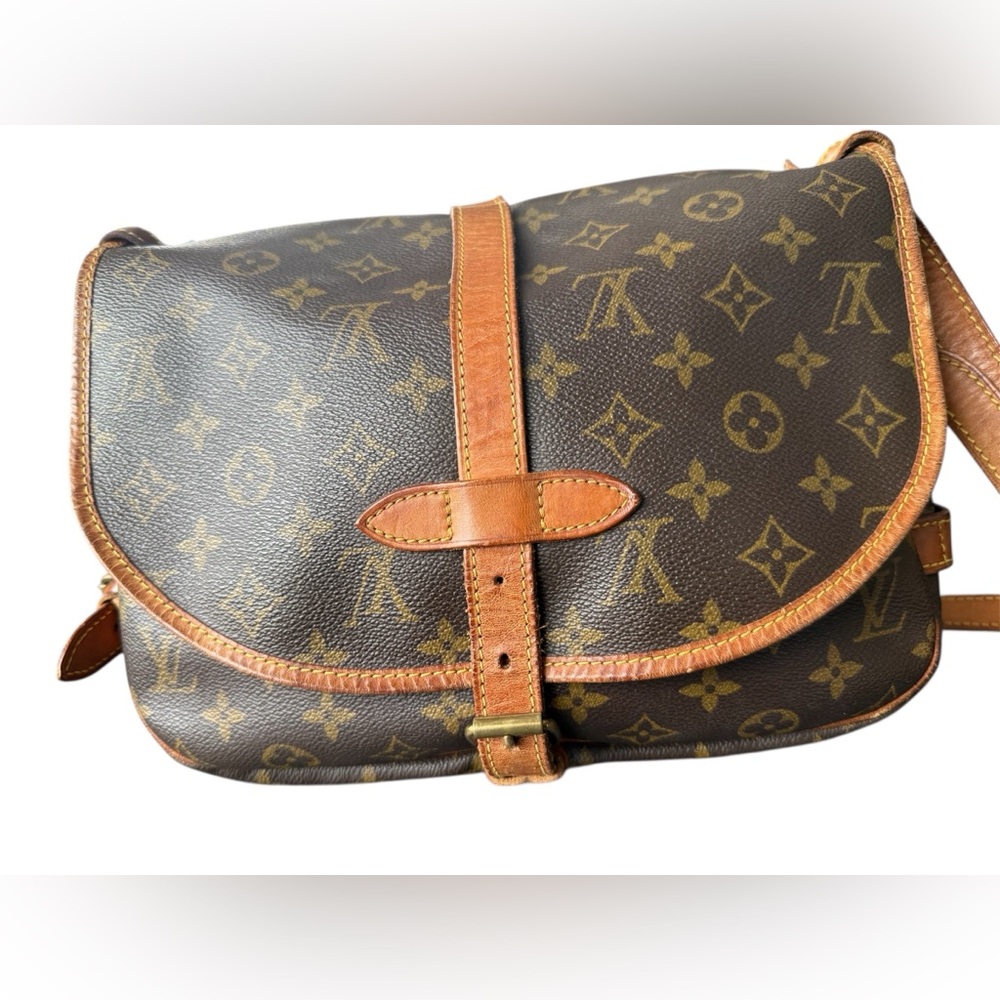 This is a Louis Vuitton Monogram Saumur 30 messenger bag